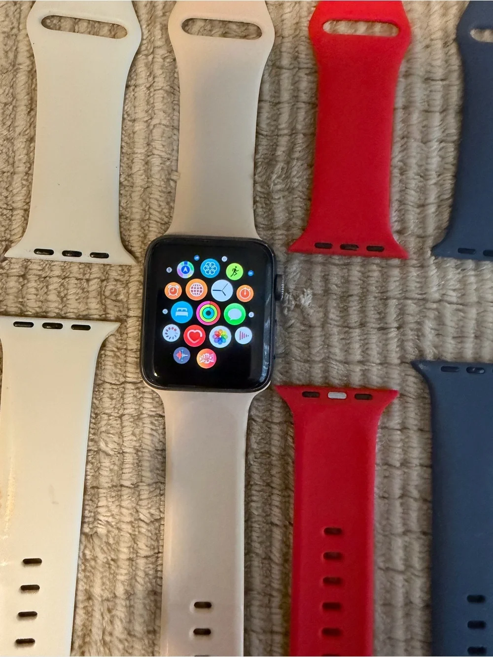 Apple Smartwatch with White, Red, and Blue Sport Bands